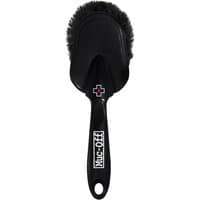 Black Muc-Off Soft Washing Brush with ergonomic handle, dense bristles, and pink cross logo on the head.