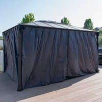 Black Palram Canopia Martinique 4300 gazebo with opaque curtains on a wooden deck.