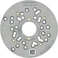 Gray circular router sub-base with multiple holes, brass inserts, and "trend" logo on top, QR code at bottom.