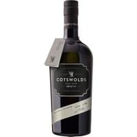 Cotswolds Dry Gin 70cl bottle with black label, silver accents, and a neck tag, featuring elegant branding.