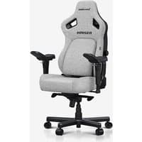 Grey Anda Seat Kaiser 4 gaming armchair with upholstered seat, adjustable armrests, and ergonomic high back design.