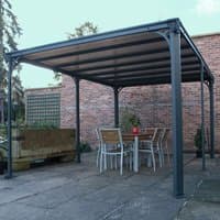 Grey Palram Canopia Milano 4300 garden gazebo with metal frame and polycarbonate roof, covering a patio dining set.