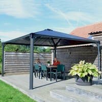 Grey Palram Canopia Palermo 4300 garden gazebo with metal frame and sloped roof on a wooden deck.