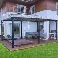 Grey Palram Canopia Martinique 5000 gazebo with aluminum frame, polycarbonate roof panels, and open sides on a wooden deck.