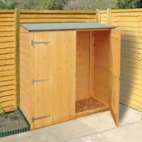 Shire Wooden Garden Storage Unit with double doors, natural wood finish, and sloped roof against wooden fence.