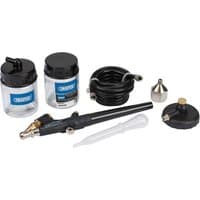 Black Draper airbrush kit with two jars, hose, nozzle, and dropper, featuring blue labels and gold accents.