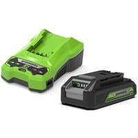 Green and black Greenworks 24V lithium-ion battery with matching charger, featuring LED indicators and compact design.