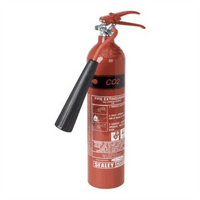 Red Sealey portable CO2 fire extinguisher with black nozzle and pressure gauge.