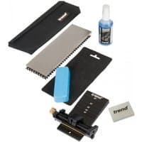 Trend diamond honing kit with sharpening stone, blue cleaning block, angle guide, honing fluid, and black storage pouch.