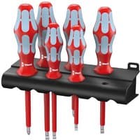 Red and gray Wera screwdriver set with ergonomic handles in a black wall-mountable holder.