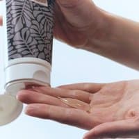 Australian Bodycare Body Wash 200ML tube with leaf pattern, white cap, dispensing clear gel into hand.