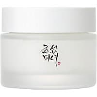 White jar of Beauty of Joseon Dynasty Cream with black Korean script on a frosted glass container.