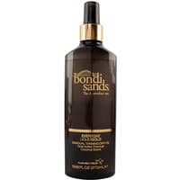 Bondi Sands Gradual Tanning Oil, dark brown bottle, gold cap, 270ml, with gold text and spray nozzle.