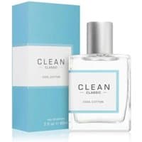 Clear glass bottle with silver cap, labeled "Clean Classic Cool Cotton," next to a blue and white box.