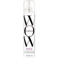 White cylindrical spray bottle with bold black "WOW" text, clear cap, and purple "raise the root" label.