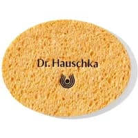 Oval yellow Dr Hauschka cosmetic sponge with logo and text on surface.