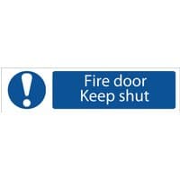 Blue and white "Fire Door Keep Shut" sign with exclamation mark symbol on the left.