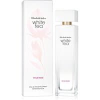 Tall, rectangular glass bottle with white cap, labeled "White Tea Wild Rose," next to matching floral box.