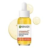 Garnier Vitamin C Brightening Serum, clear bottle with white dropper, orange label, 30ml size.