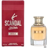 Red box with gold lettering, clear glass bottle with gold cap, containing amber liquid, Jean Paul Gaultier Scandal Absolu.