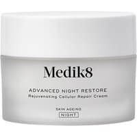 Medik8 Advance Night Restore 50ml jar, white lid, frosted glass container, black text detailing rejuvenating cream.