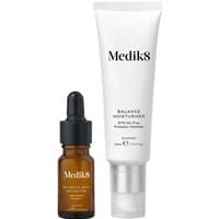 White Medik8 Balance Moisturiser tube and amber Glycolic Acid Activator bottle with dropper.