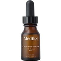 Brown glass bottle of Medik8 Calmwise Serum with black dropper cap, white text label.