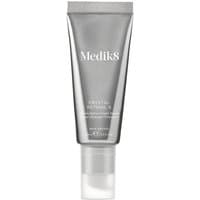 Gray tube of Medik8 Crystal Retinal 6 with white cap, silver accents, and white text on the front.