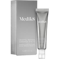Medik8 Crystal Retinal Ceramide Eye 10, silver tube with white cap, next to matching silver box, 15ml.