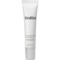 White tube of Medik8 Illuminating Eye Balm 15ml with black text and a pointed applicator tip.