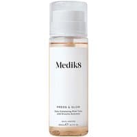 Clear bottle of Medik8 Press & Glow 200ml exfoliating toner with white label and silver pump dispenser.