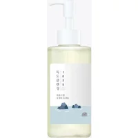 Round Lab 1025 Dokdo Cleansing Oil 200ml with white pump, clear bottle, and minimalist label featuring blue mountains.