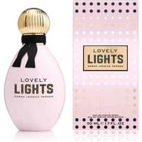 Pink oval perfume bottle with gold ribbed cap, black bow, and matching box, labeled "Lovely Lights" by Sarah Jessica Parker.