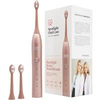 Rose gold sonic toothbrush with two brush heads, sleek design, and branded box featuring two women.