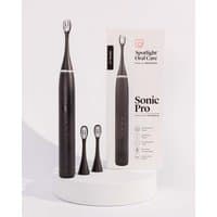 Black Spotlight Oral Care Sonic Pro toothbrush with three brush heads and branded packaging.