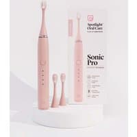 Pink Spotlight Oral Care Sonic Pro toothbrush with two extra brush heads and branded packaging.