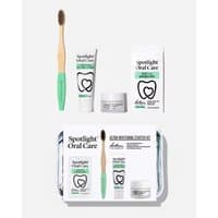 Spotlight Oral Care Teeth Whitening Starter Kit with bamboo toothbrush, toothpaste, whitening strips, and mouth tray.
