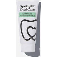 Spotlight Oral Care Ultra Whitening Professional Toothpaste in white tube with black tooth and heart design.