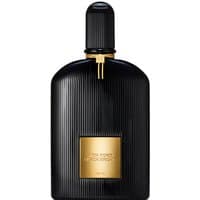 Black ribbed Tom Ford Black Orchid perfume bottle with gold label and cap, 100 ml size.