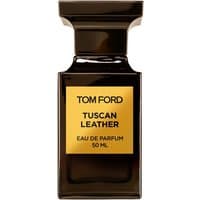 Dark glass bottle of Tom Ford Tuscan Leather Eau de Parfum, gold label, 50 ml, unisex leather fragrance.