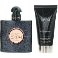 Black glittery bottle of Yves Saint Laurent Black Opium perfume and matching black tube of body lotion.