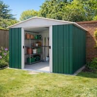 Green metal shed with white trim, sliding doors, and gable roof, measuring 10' x 10', set in a garden.