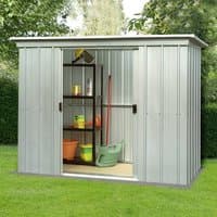 Silver Yardmaster metal pent shed, 10' x 4', with sliding double doors, vertical ridges, and garden tools inside.