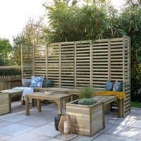 Wooden garden seating set with slatted back panels, benches, table, and planters on a patio.