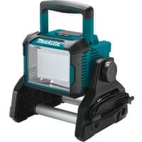 Makita cordless LED worklight in teal and black with a sturdy handle and adjustable base.