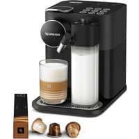 Black Nespresso Gran Lattissima coffee machine with milk frother, touch buttons, and three coffee pods.