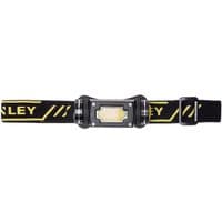 Black Stanley magnetic head torch with yellow logo, adjustable strap, and rectangular LED light.