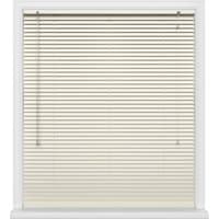 White Zephyr window blinds with horizontal slats and pull cords, framed by a white window casing.