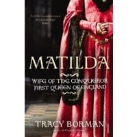 "Matilda book cover featuring a red velvet gown with fur trim, gold text, and medieval design elements."