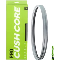 Cushcore 29er Pro grey tyre insert, circular with textured surface, next to green packaging and valve stem.